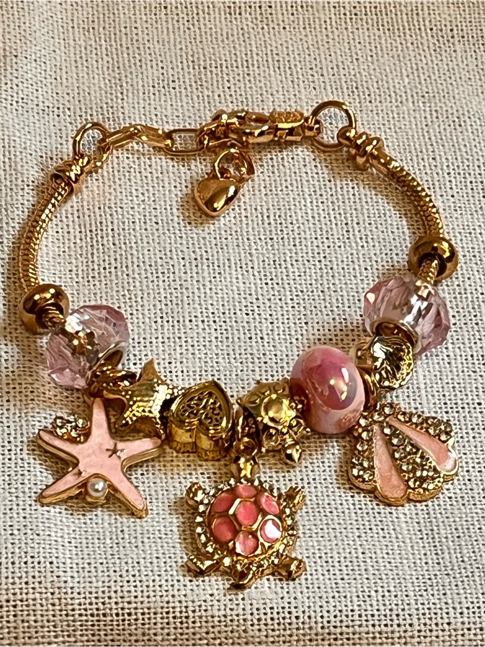 Gold-Tone Pink Enamel Sea Charm Bracelet